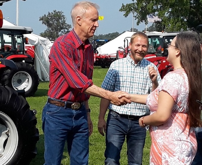 Governor Bruce Rauner with Chad Wallace and Rebecca Osland, who fought for Illinois hemp production